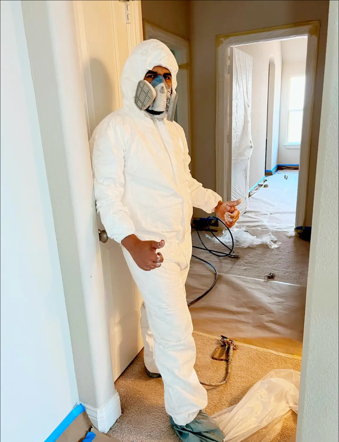 JSE painter in full PPE on a Fort Worth interior repaint